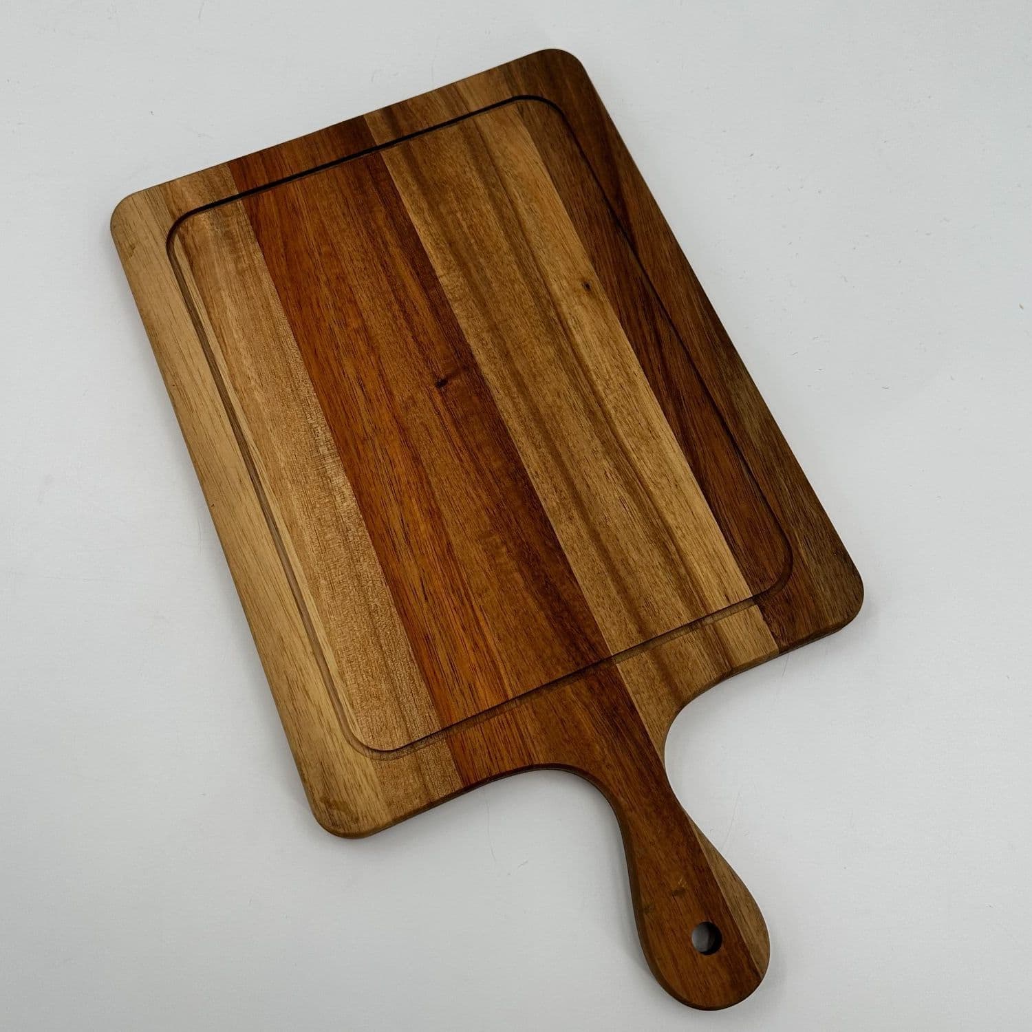 Acacia serving board with an extended handle